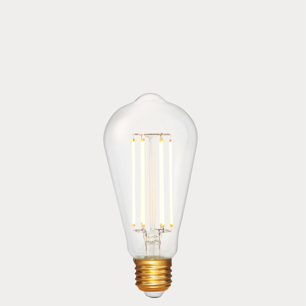 Dulora 4.2W Edison LED Bulb E27 in Extra Warm White illuminated showing warm amber glow through clear ST64 glass