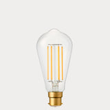 Dulora 4.2W Edison LED Bulb B22 in Extra Warm White with visible amber filaments in clear ST64 glass