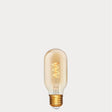 Dulora 4W Vintage Tubular Spiral LED Bulb E27 in Ultra Warm White glowing with warm spiral filament through amber tube