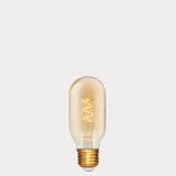 Dulora 4W Vintage Tubular Spiral LED Bulb E27 in Ultra Warm White glowing with warm spiral filament through amber tube