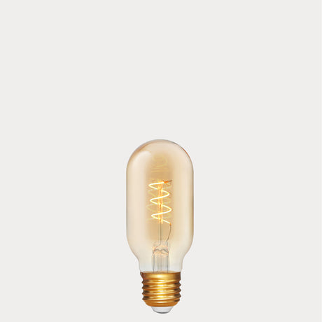 Dulora 4W Vintage Tubular Spiral LED Bulb E27 in Ultra Warm White glowing with warm spiral filament through amber tube