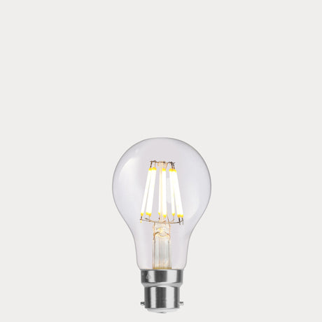 Dulora 8W 12-24 Volt AC/DC GLS LED Bulb B22 Clear in Warm White illuminated with warm glow through clear A60 glass